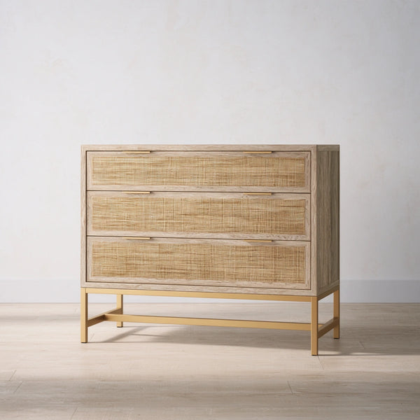 Light brown wooden dresser with three wide storage drawers, featuring sleek handles and a smooth finish.